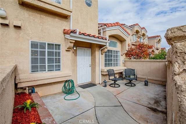 property entrance with a patio