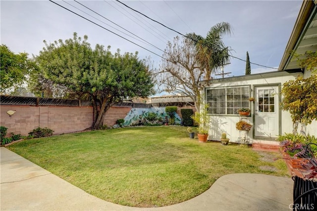 view of yard with a fenced backyard