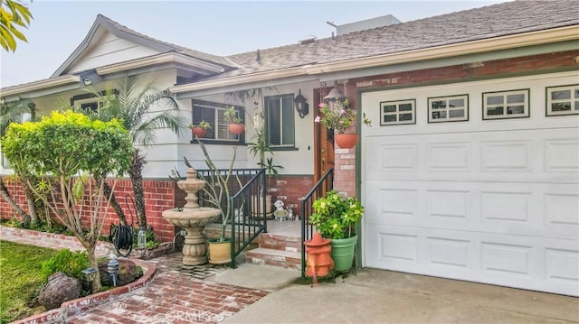 view of front facade featuring brick siding, driveway, and an attached garage