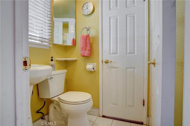 bathroom featuring tile patterned floors and toilet