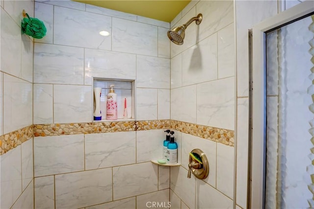 bathroom with tiled shower