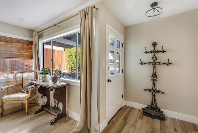 doorway with light hardwood / wood-style floors