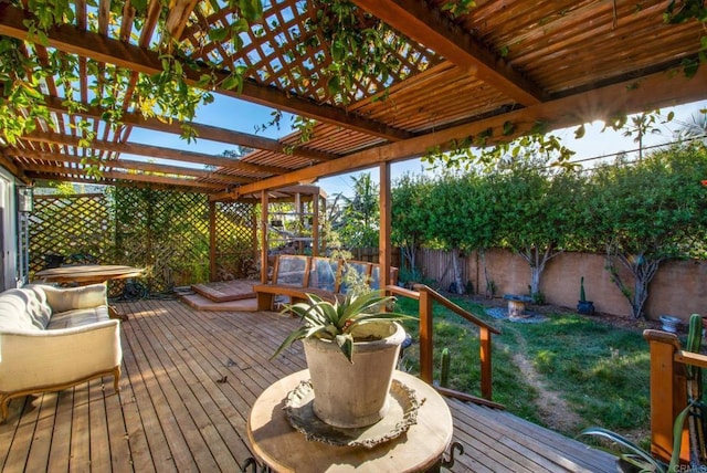 wooden deck featuring a lawn, a pergola, and outdoor lounge area