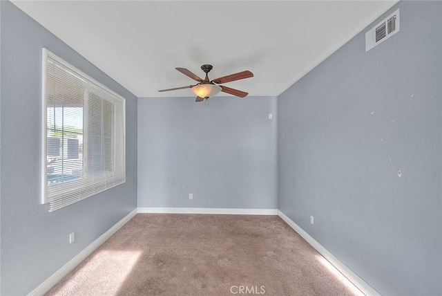 carpeted empty room with ceiling fan