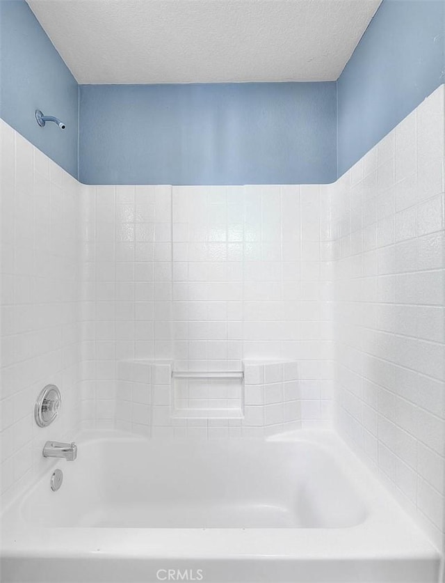 bathroom with a textured ceiling