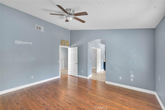 unfurnished room with light wood-type flooring, ceiling fan, and lofted ceiling