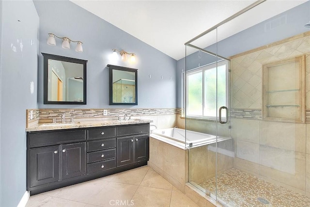 bathroom with vanity, tile patterned flooring, plus walk in shower, and lofted ceiling