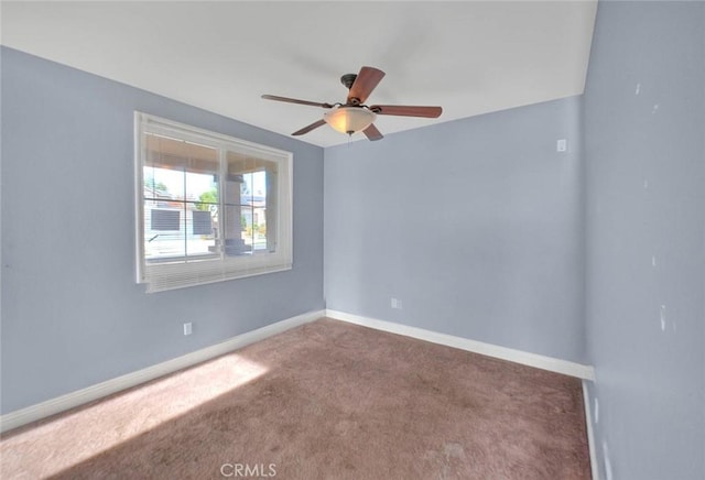 empty room with carpet and ceiling fan