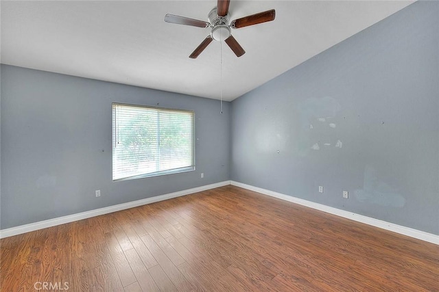 spare room featuring hardwood / wood-style floors and ceiling fan