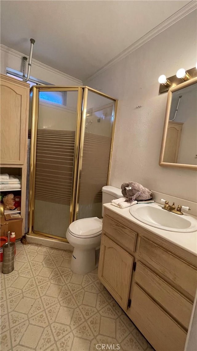 bathroom with toilet, walk in shower, ornamental molding, and vanity