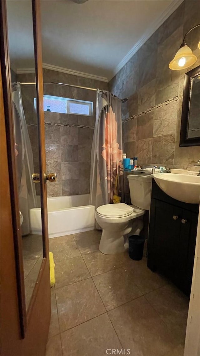 full bathroom featuring tile patterned floors, vanity, tile walls, toilet, and shower / tub combo with curtain