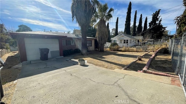 single story home featuring a garage