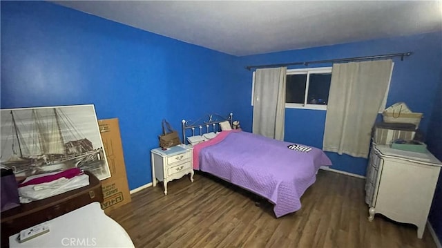 bedroom featuring dark hardwood / wood-style floors