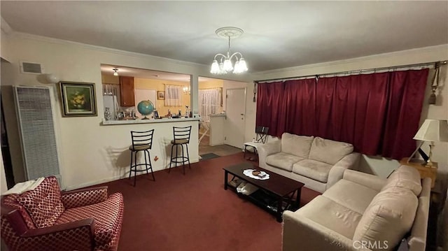 living room with an inviting chandelier, ornamental molding, and carpet flooring