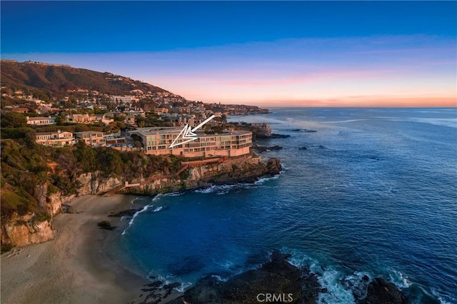 aerial view at dusk with a water and mountain view