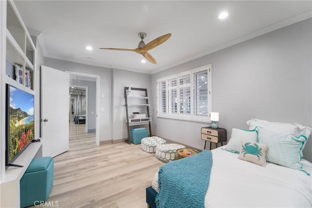 bedroom featuring crown molding, ceiling fan, and light hardwood / wood-style floors