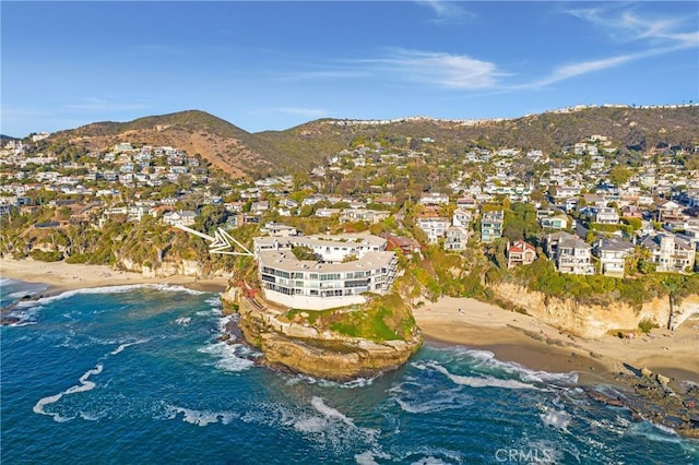 aerial view with a view of the beach and a water and mountain view