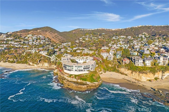 bird's eye view featuring a residential view, a view of the beach, and a water and mountain view