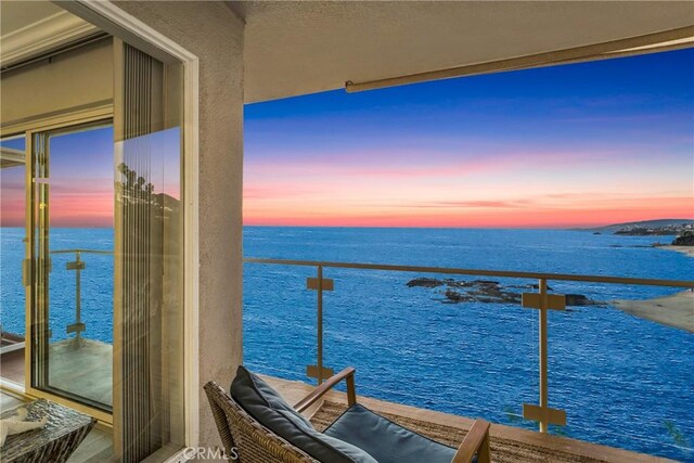 balcony at dusk with a water view