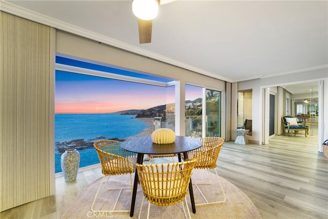 31561 Table Rock Dr Unit 211, Laguna Beach, CA 92651 - dining area with crown molding, wood finished floors, a water view, and ceiling fan