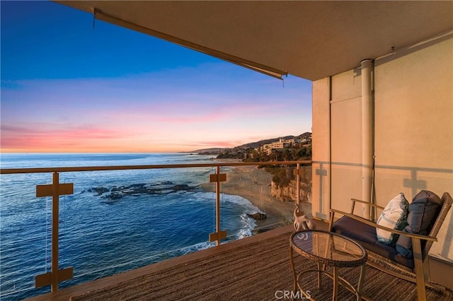 balcony at dusk with a water view
