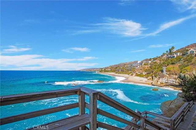 view of pool with a beach view and a water view