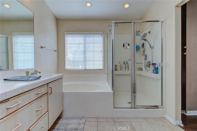 bathroom with vanity, tile patterned floors, and independent shower and bath