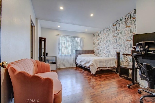 bedroom with hardwood / wood-style flooring