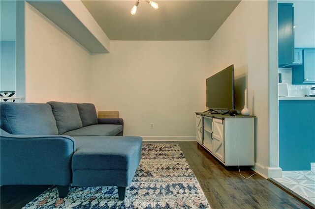 living room featuring dark wood-type flooring