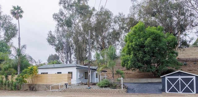 exterior space with a storage shed