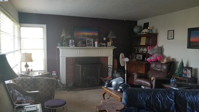 living room with carpet flooring and a brick fireplace