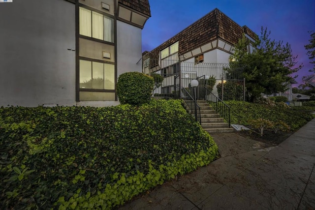 view of property exterior at dusk