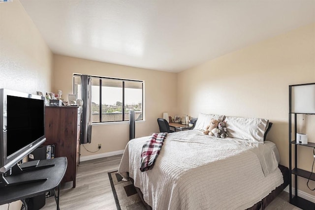 bedroom with light hardwood / wood-style flooring