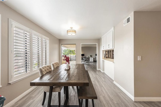 dining area with light wood-type flooring