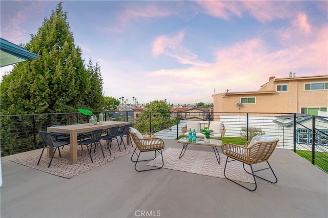 view of patio terrace at dusk