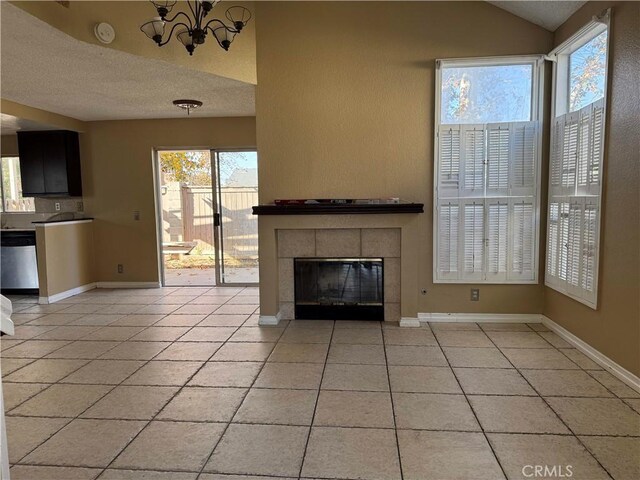 unfurnished living room featuring a wealth of natural light, light tile patterned floors, and a fireplace