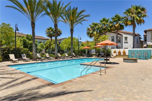 view of swimming pool with a patio