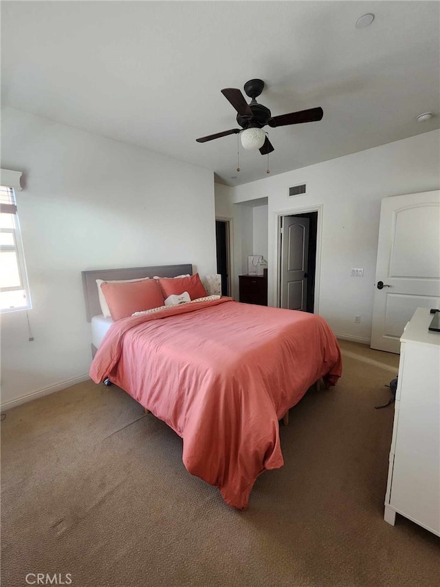 bedroom with ceiling fan and carpet floors