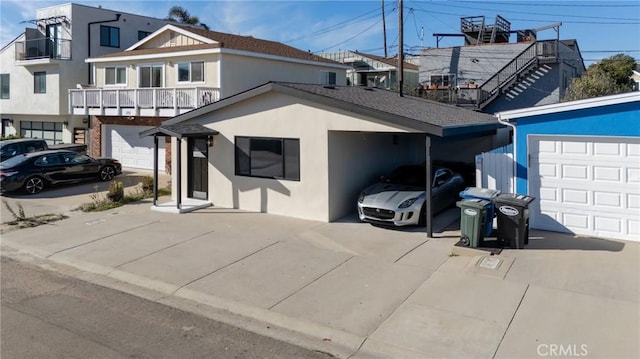 view of front facade featuring a garage and a carport