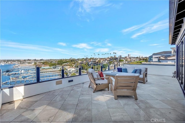 view of patio with a water view and an outdoor hangout area