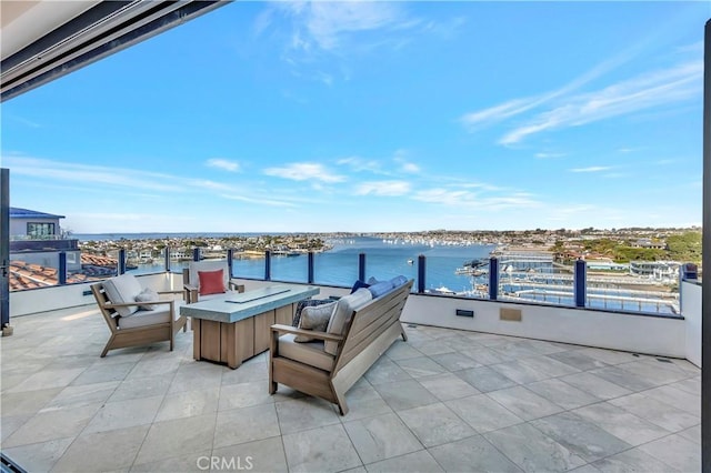 view of patio with a water view