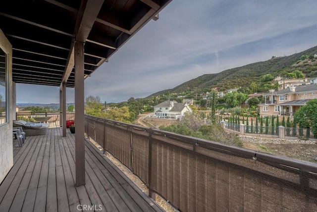 wooden terrace featuring a mountain view