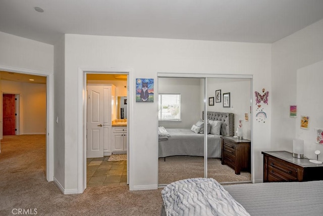 carpeted bedroom with a closet