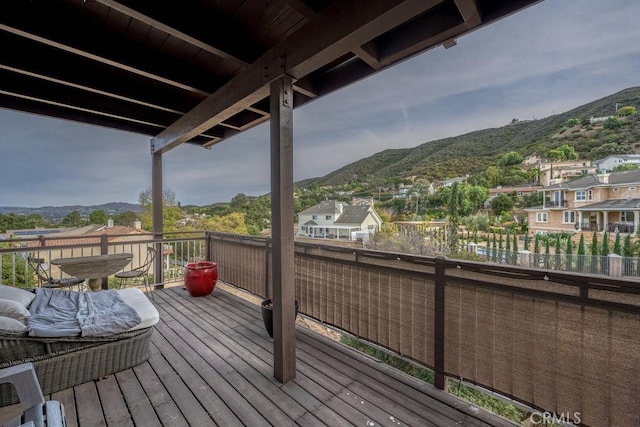 wooden terrace with a mountain view