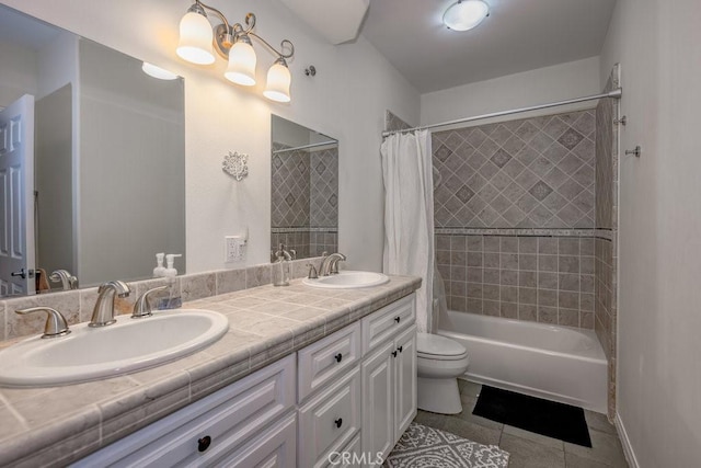 full bathroom featuring toilet, shower / bath combo, vanity, and tile patterned floors