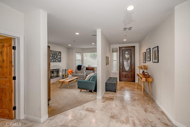 view of carpeted entrance foyer