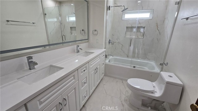 full bathroom featuring vanity, toilet, and combined bath / shower with glass door