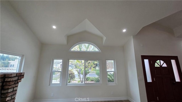 foyer entrance with a healthy amount of sunlight and lofted ceiling