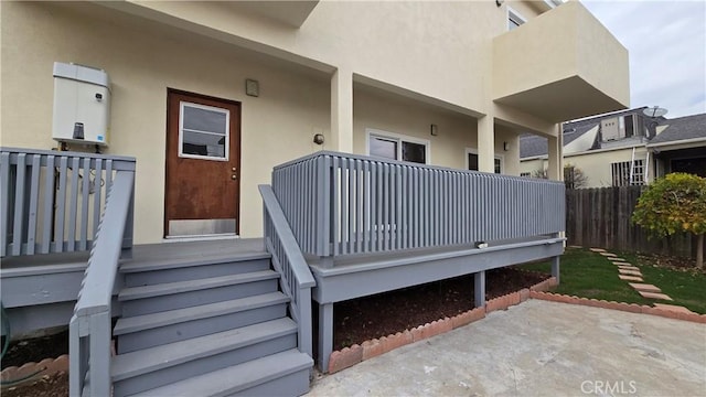 rear view of property with a patio area and a wooden deck