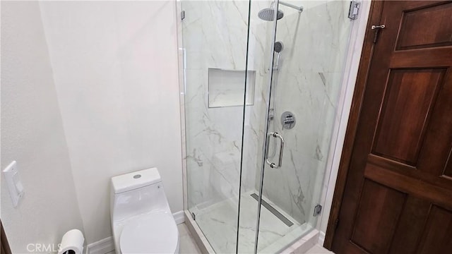 bathroom with toilet and walk in shower